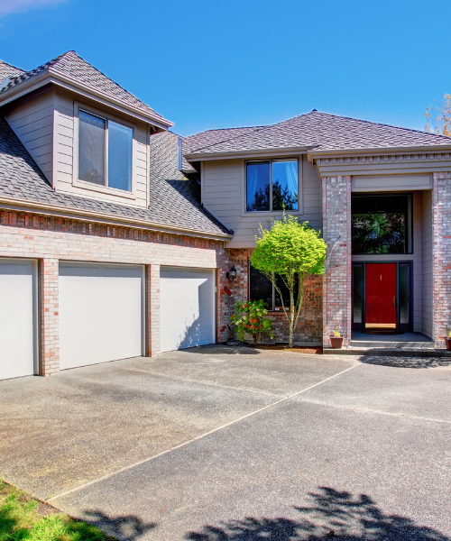 A two story house with a red door